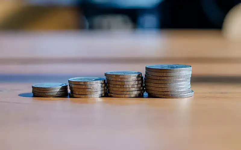 Stacks of coins representing financial growth and investment success, highlighting the importance of strategic financial planning. Perfect for illustrating financial consulting, wealth management, and business investment themes.
